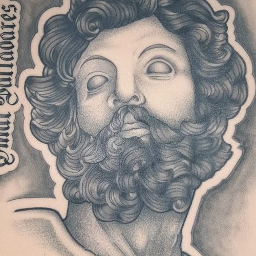 The face of a bearded classical statue with blank eyes, shaded in fine black and grey on a TrueSkin sheet.