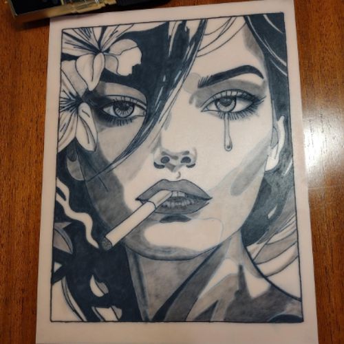 A woman's face split between fine linework and solid black, with flowers and a cigarette, tattooed on a TrueSkin sheet.